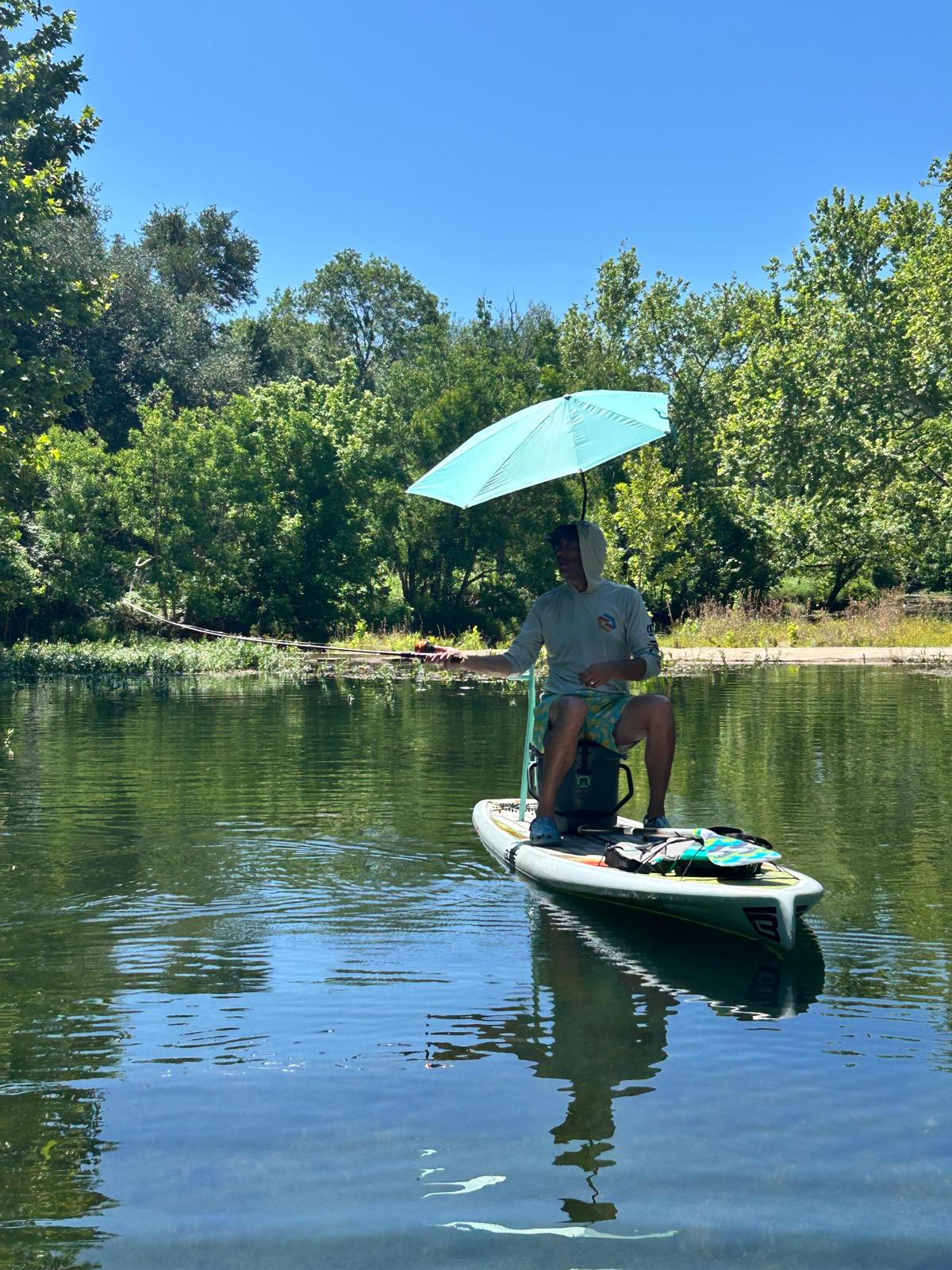 Paddle boarding and fishing on a Hill Country creek